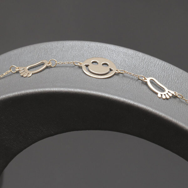 Smiley armlænke i 18 karat guld