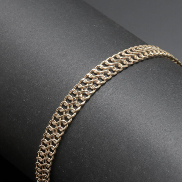 Flad flettet armlænke i 14 karat guld