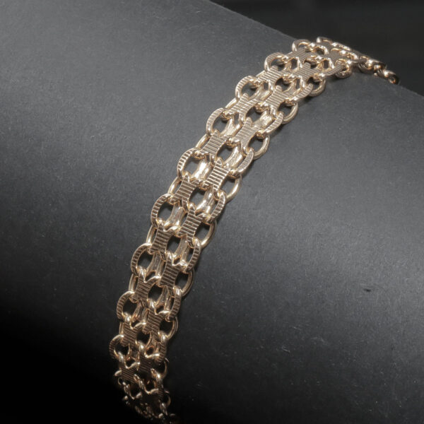 Flettet panser armlænke i 18 karat guld – eksklusivt og tidløst design