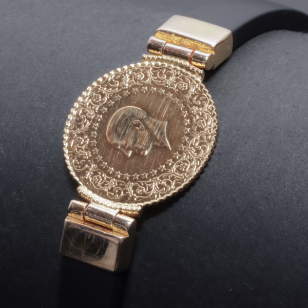 Armbånd med 25 kurush(22karat) med fatninge i 14 karat guld
